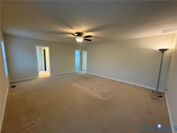 a view of a livingroom with a chandelier fan