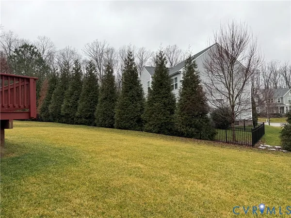 a view of balcony with wooden floor and outdoor seating