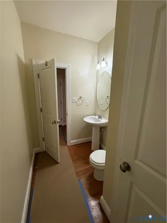 a view of a bathroom with a sink and mirror