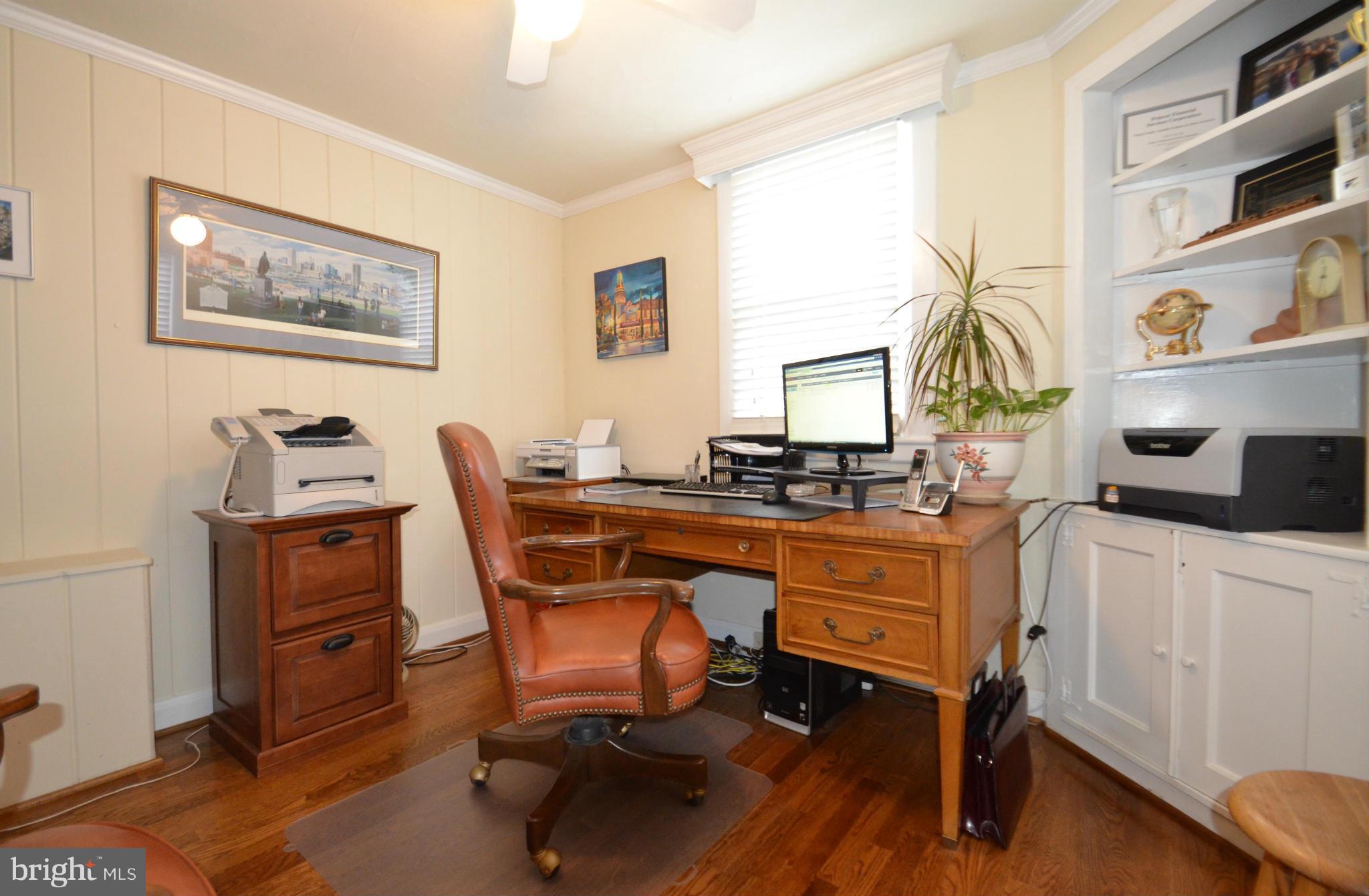 307 East Highfield Road Baltimore, MD 21218 - Photo 13 of 30 a view of a workspace with furniture and a window