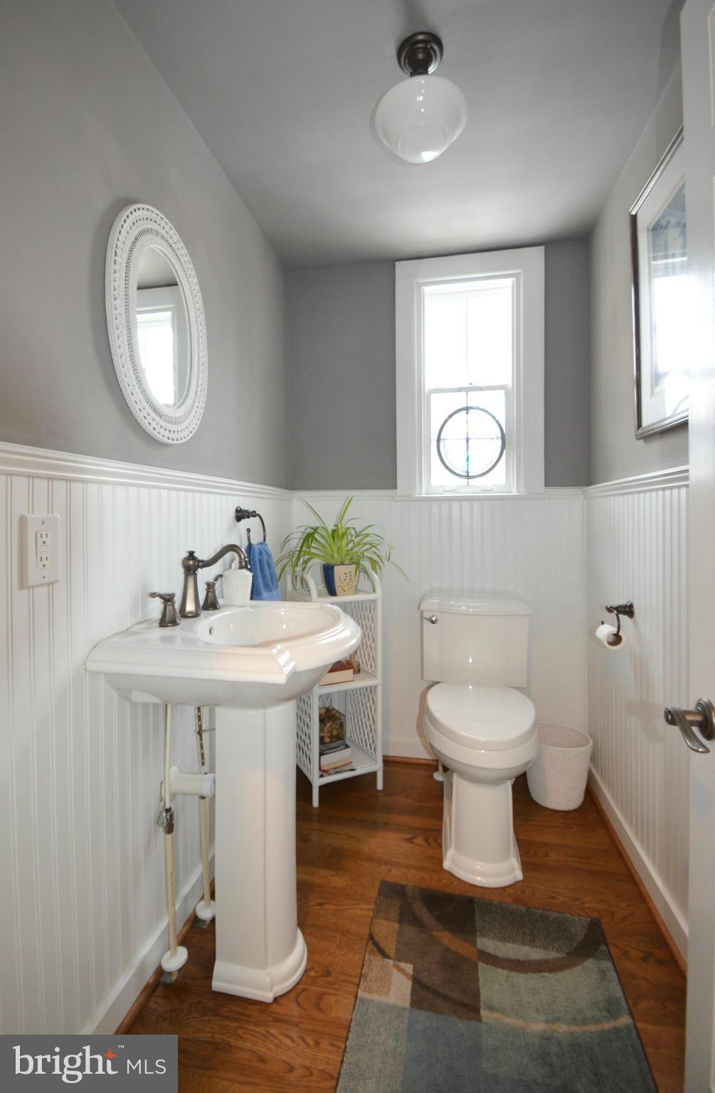 307 East Highfield Road Baltimore, MD 21218 - Photo 14 of 30 a bathroom with a toilet sink and mirror