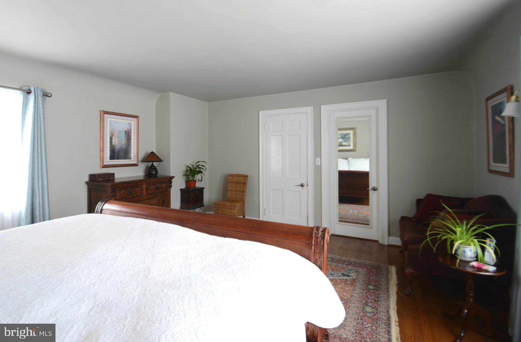 307 East Highfield Road Baltimore, MD 21218 - Photo 16 of 30 a bedroom with a bed and a dresser