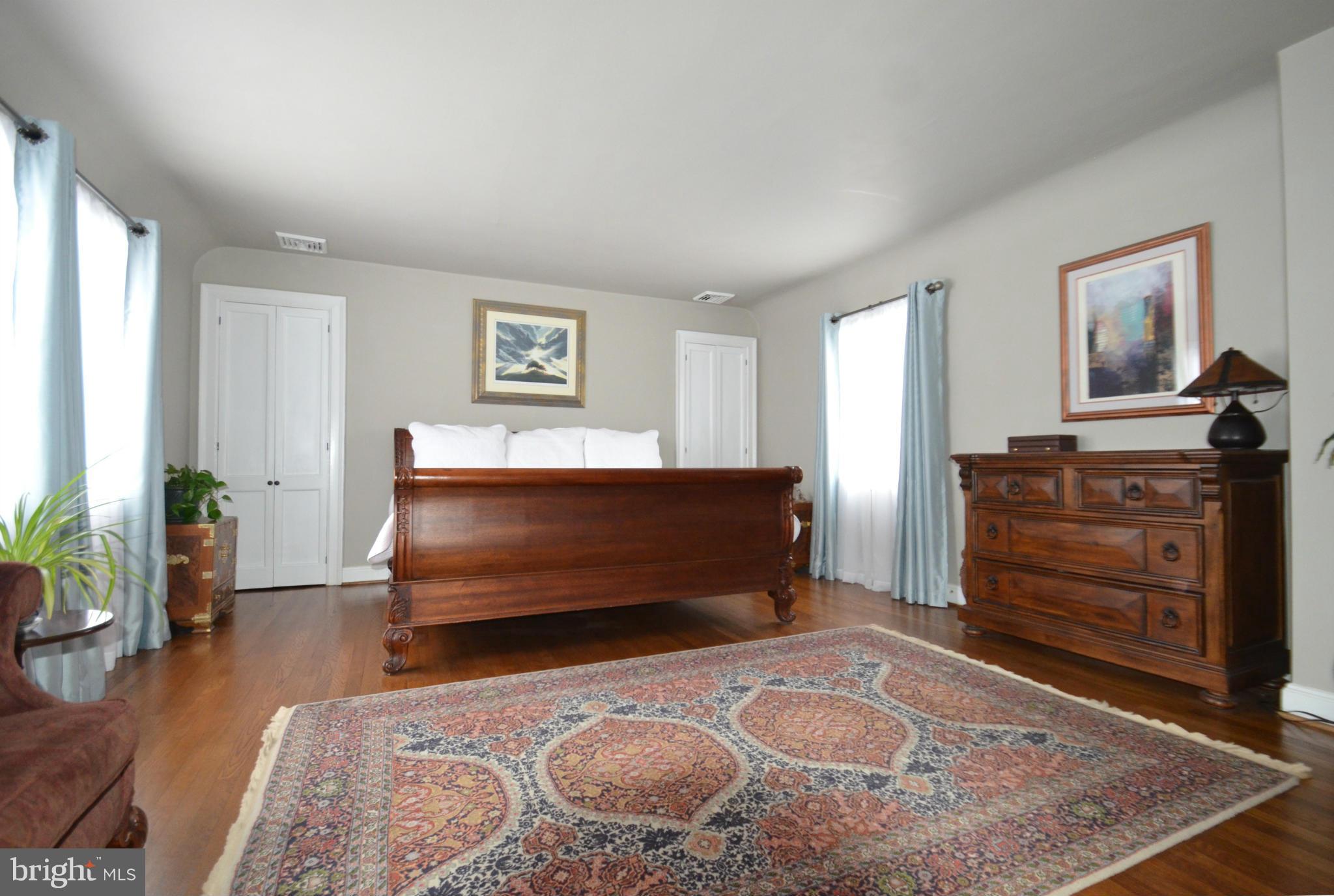 307 East Highfield Road Baltimore, MD 21218 - Photo 17 of 30 a bedroom with a bed and a dresser