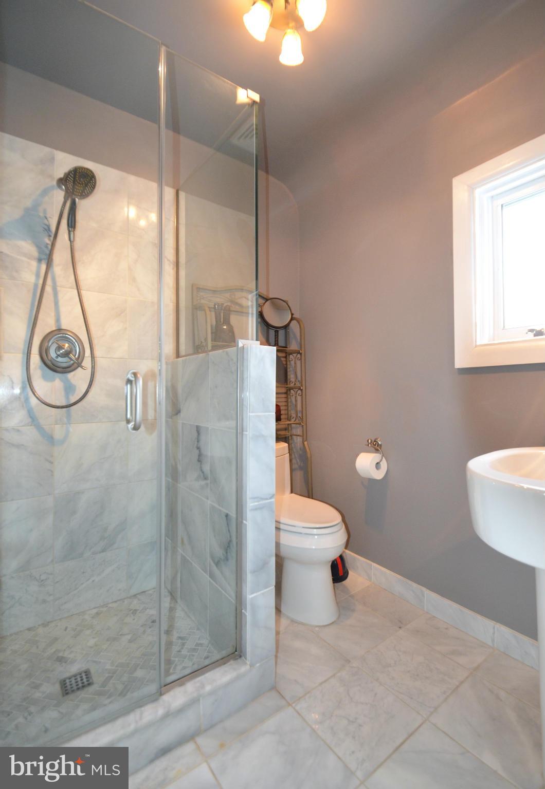 307 East Highfield Road Baltimore, MD 21218 - Photo 18 of 30 a bathroom with a toilet and a shower