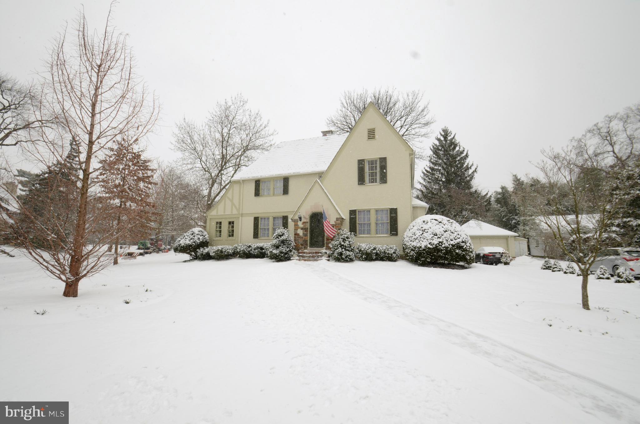 307 East Highfield Road Baltimore, MD 21218 - Photo 28 of 30 a front view of a house with a yard covered in snow