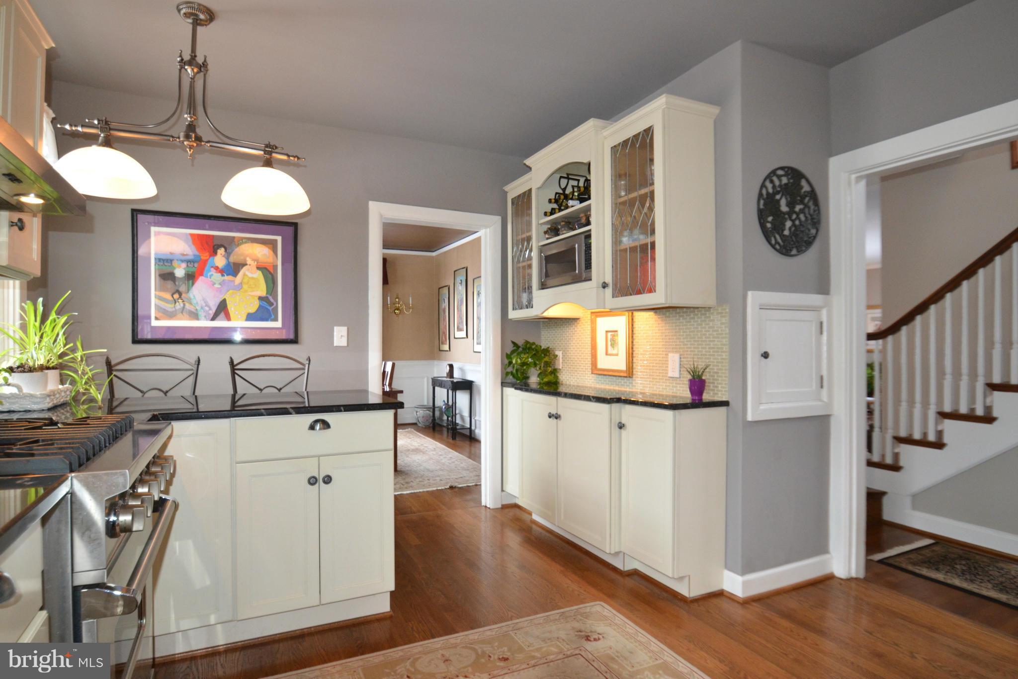 307 East Highfield Road Baltimore, MD 21218 - Photo 5 of 30 a view of a kitchen area with furniture and wooden floor