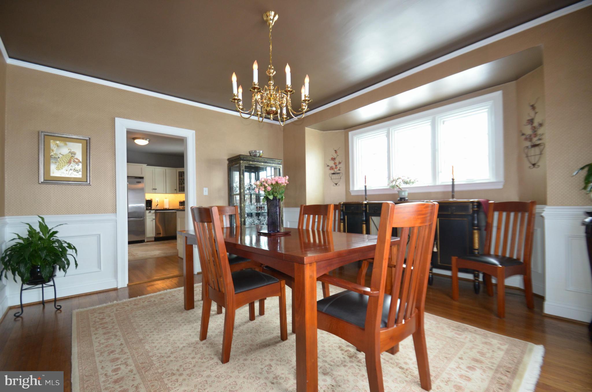 307 East Highfield Road Baltimore, MD 21218 - Photo 6 of 30 a view of a dining room with furniture window and wooden floor