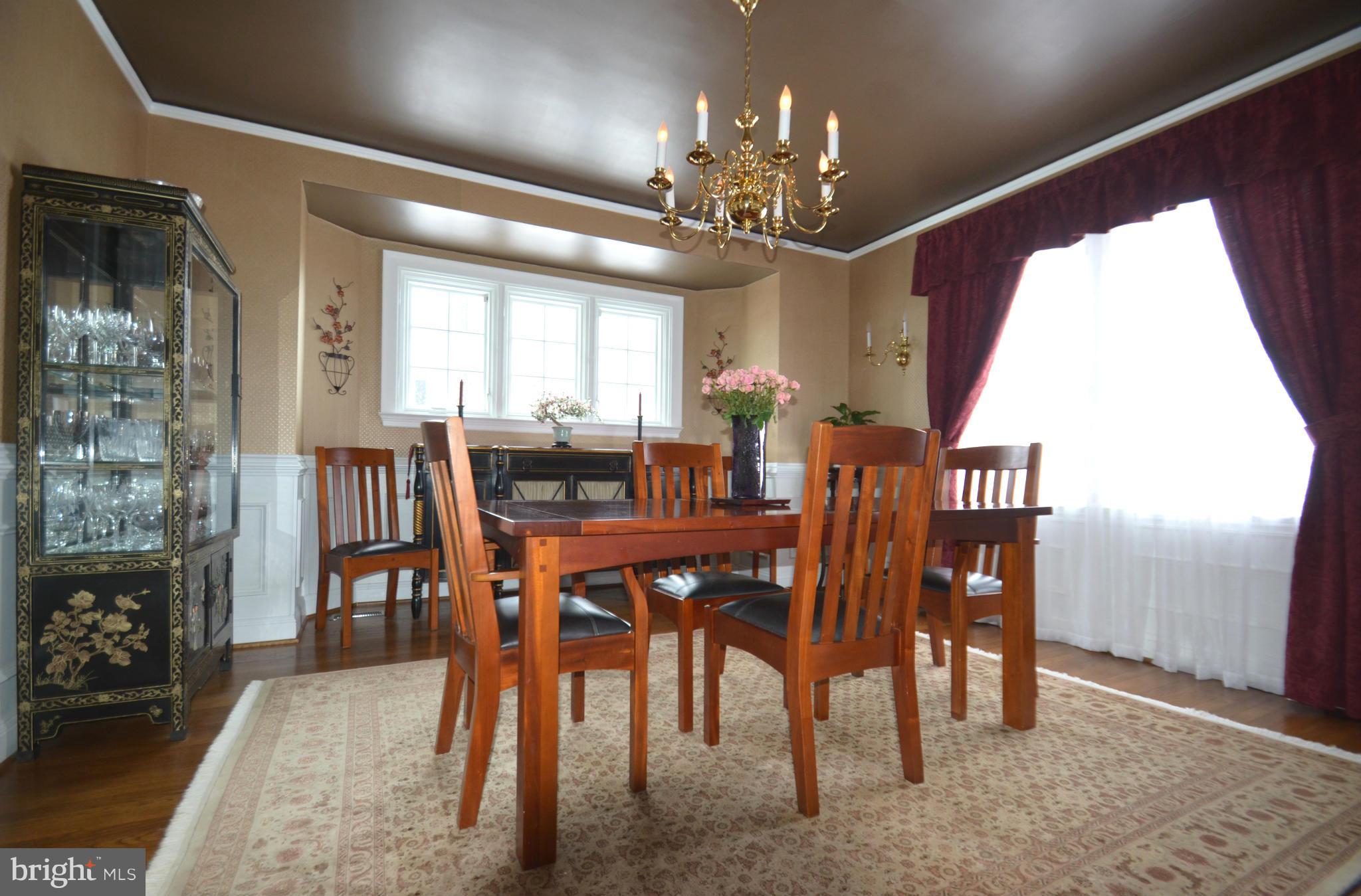 307 East Highfield Road Baltimore, MD 21218 - Photo 7 of 30 a view of a dining room with furniture and chandelier