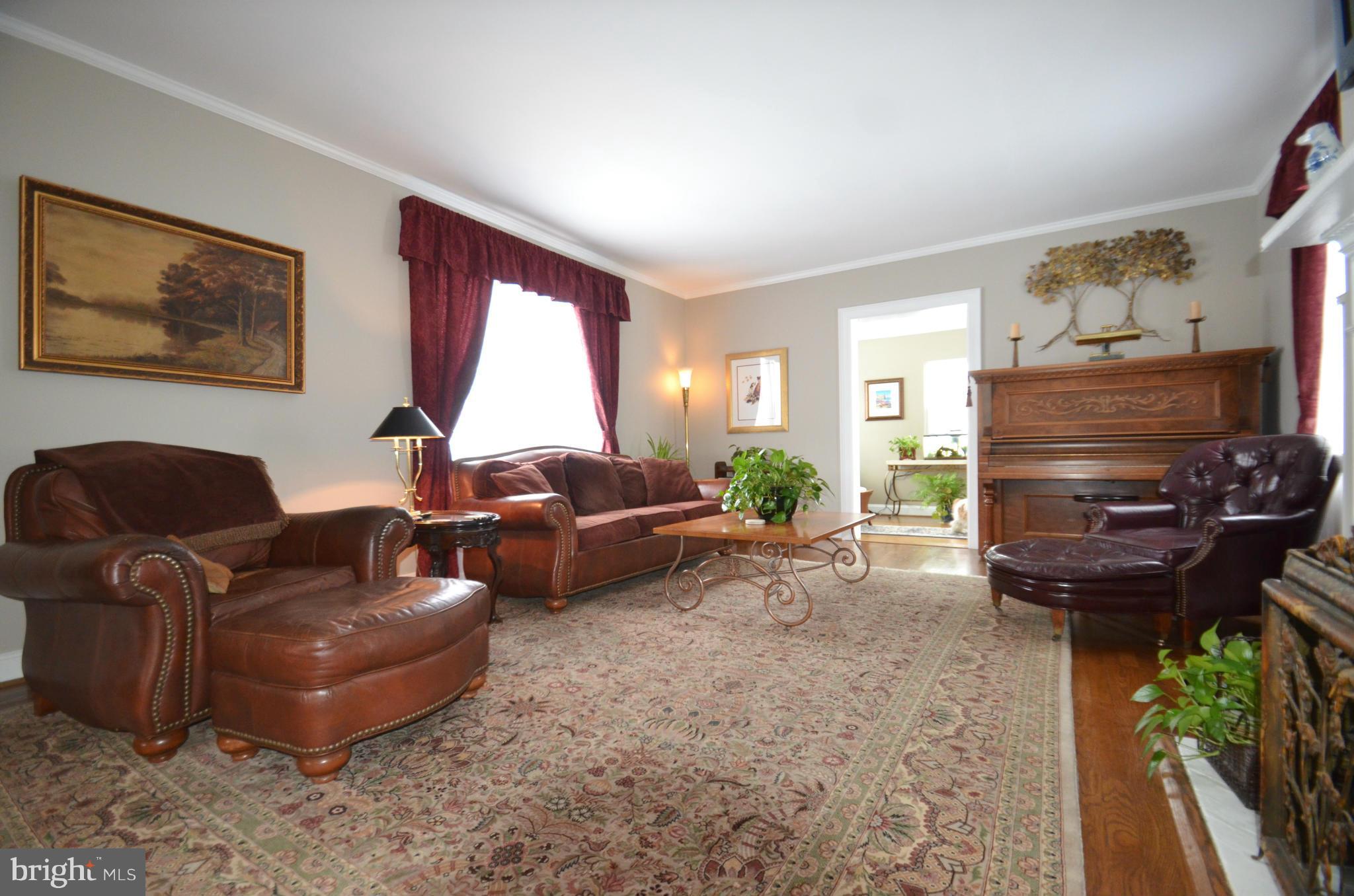 307 East Highfield Road Baltimore, MD 21218 - Photo 10 of 30 a living room with furniture and a fireplace