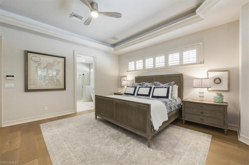 7263 Acorn Way Naples, FL 34119 - Photo 13 of 34 a bed room with a bed and a window