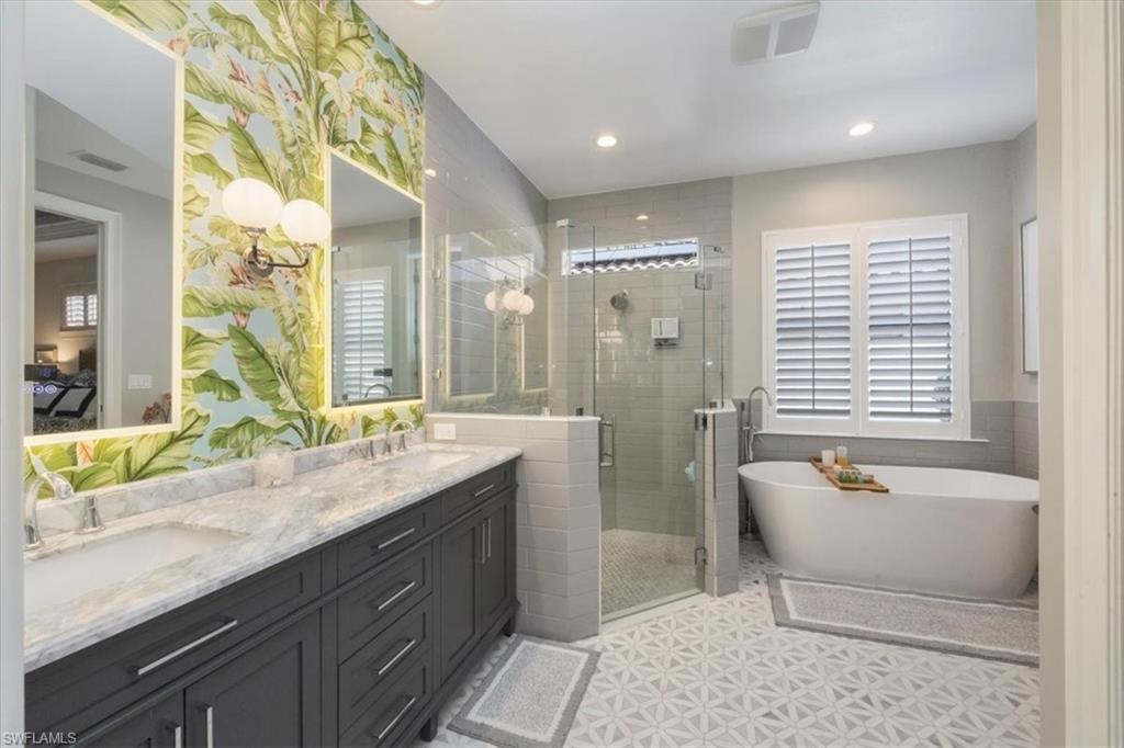 7263 Acorn Way Naples, FL 34119 - Photo 14 of 34 a spacious bathroom with sink shower and bathtub