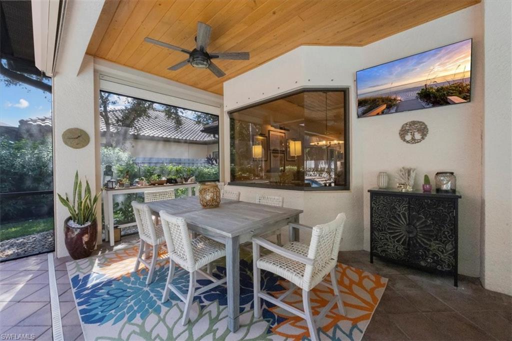 7263 Acorn Way Naples, FL 34119 - Photo 19 of 34 a dining room with furniture and window