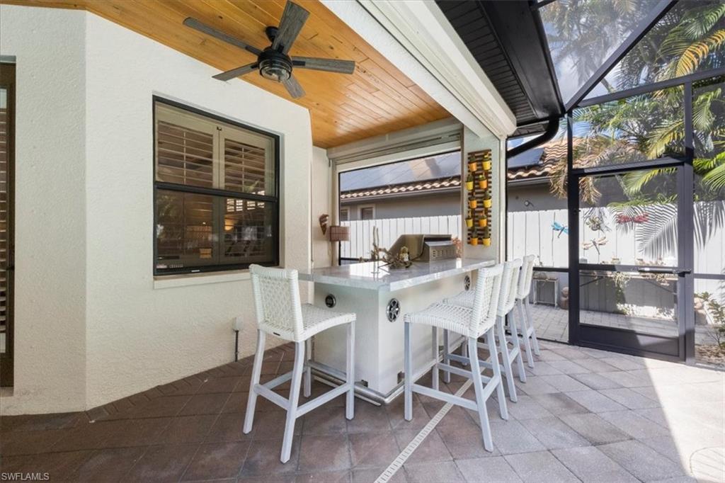 7263 Acorn Way Naples, FL 34119 - Photo 20 of 34 a view of a dining room with furniture and a window