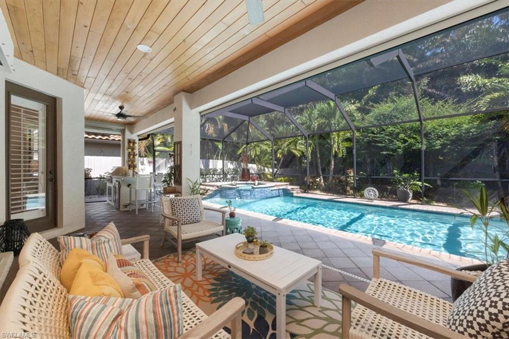 7263 Acorn Way Naples, FL 34119 - Photo 25 of 34 a view of outdoor dining space with a patio