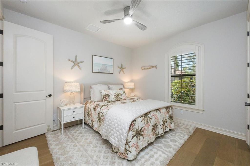 7263 Acorn Way Naples, FL 34119 - Photo 28 of 34 a bedroom with a bed and a window