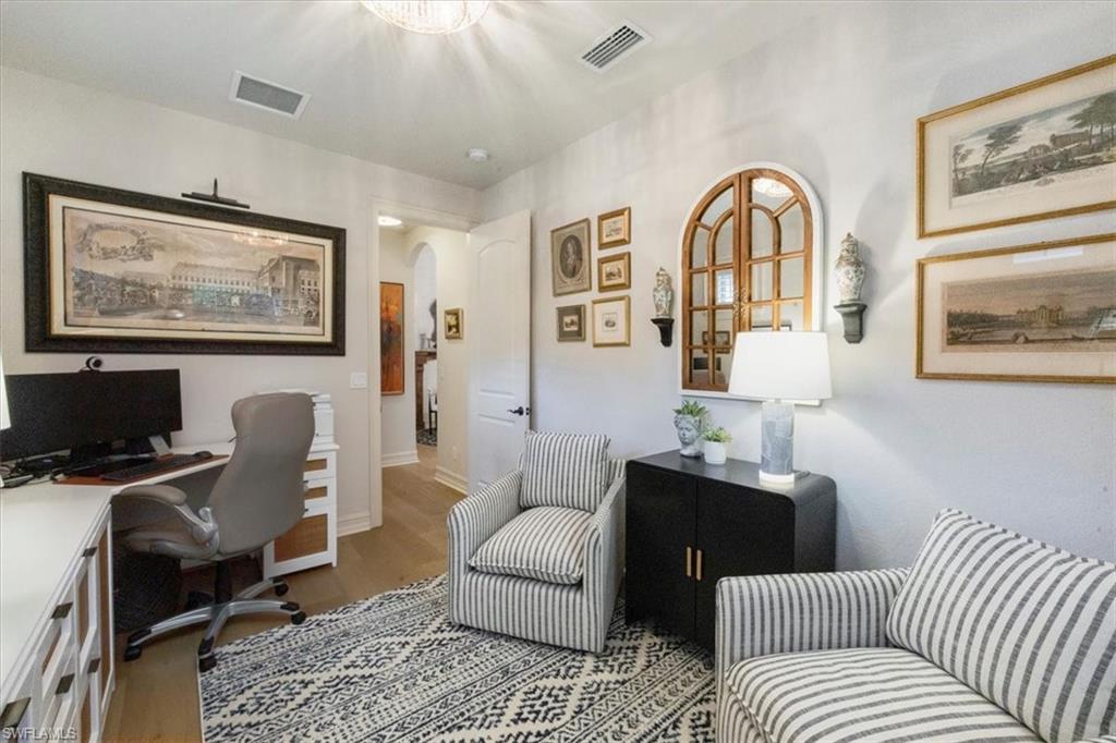 7263 Acorn Way Naples, FL 34119 - Photo 32 of 34 a view of a livingroom with workspace and a couch