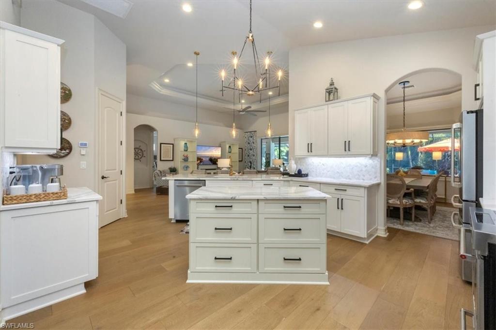 7263 Acorn Way Naples, FL 34119 - Photo 8 of 34 a bathroom with a sink double vanity
