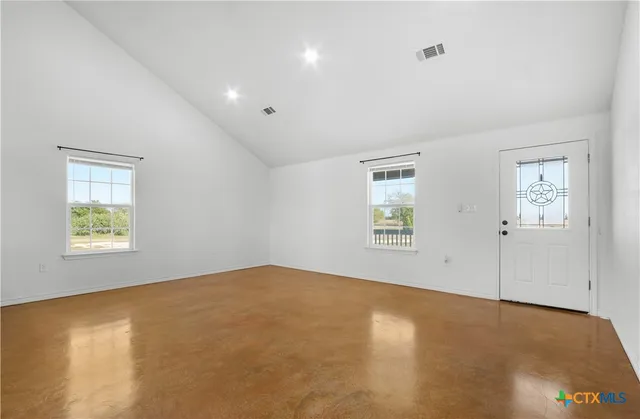 a view of an empty room with a window