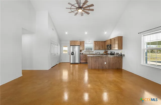 a view of a kitchen with a sink cabinets and a window