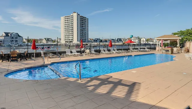a kitchen with stainless steel appliances granite countertop a sink dishwasher and cabinets