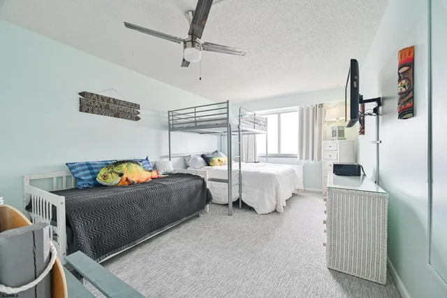 a bedroom with bed and window