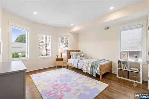 a living room with furniture and a rug