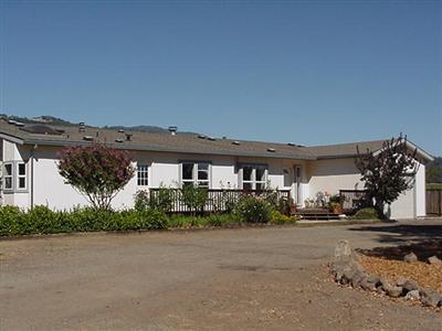 21360 River Road Geyserville, CA 95441 - Photo 2 of 12 a view of a house with a street