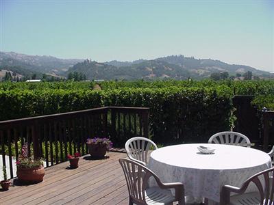 21360 River Road Geyserville, CA 95441 - Photo 4 of 12 a view of a chairs and table on the deck