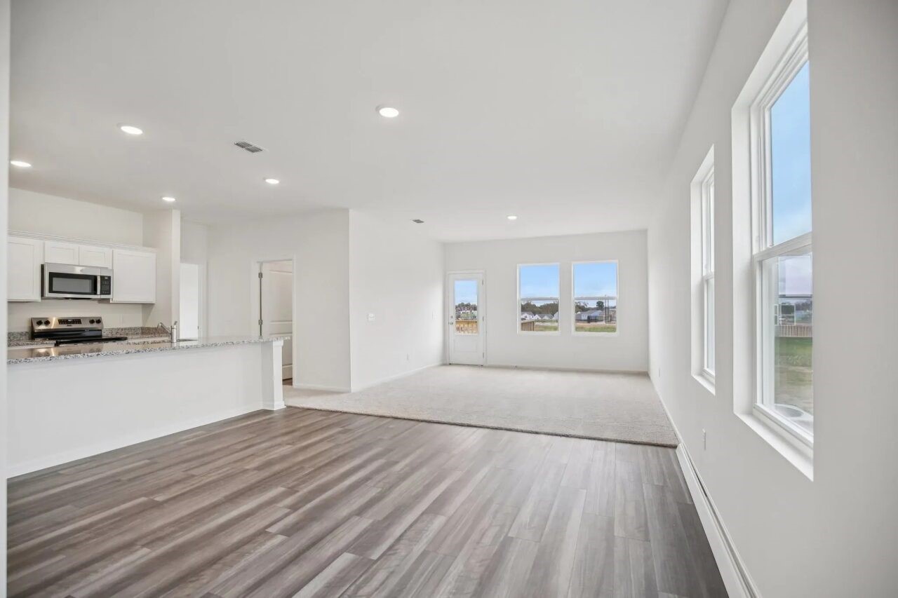 3123 Diamond Vw Lane Angleton, TX 77515 - Photo 5 of 13 a view of an empty room with wooden floor and a window