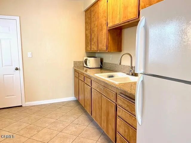 a view of a porch with furniture and a yard