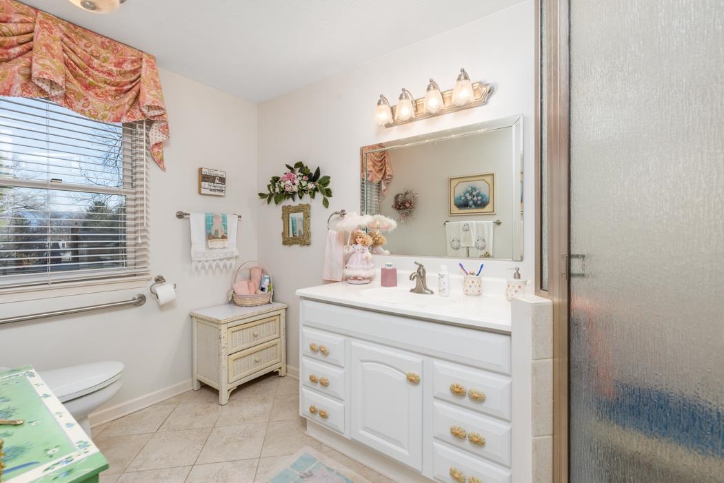 198 Baynes Road Waynesboro, VA 22980 - Photo 35 of 74 a en suite bathroom with a double vanity sink a mirror and a window