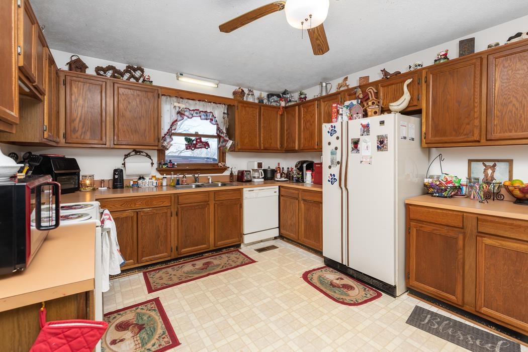 198 Baynes Road Waynesboro, VA 22980 - Photo 69 of 74 a kitchen with stainless steel appliances granite countertop a refrigerator sink and cabinets