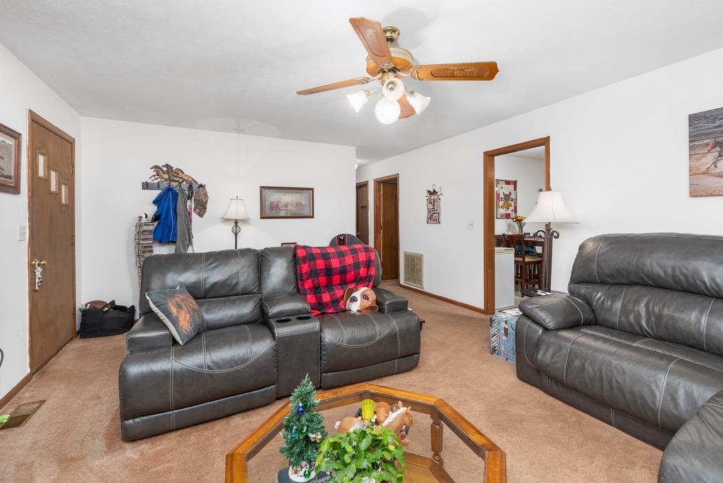 198 Baynes Road Waynesboro, VA 22980 - Photo 72 of 74 a living room with furniture and a chandelier