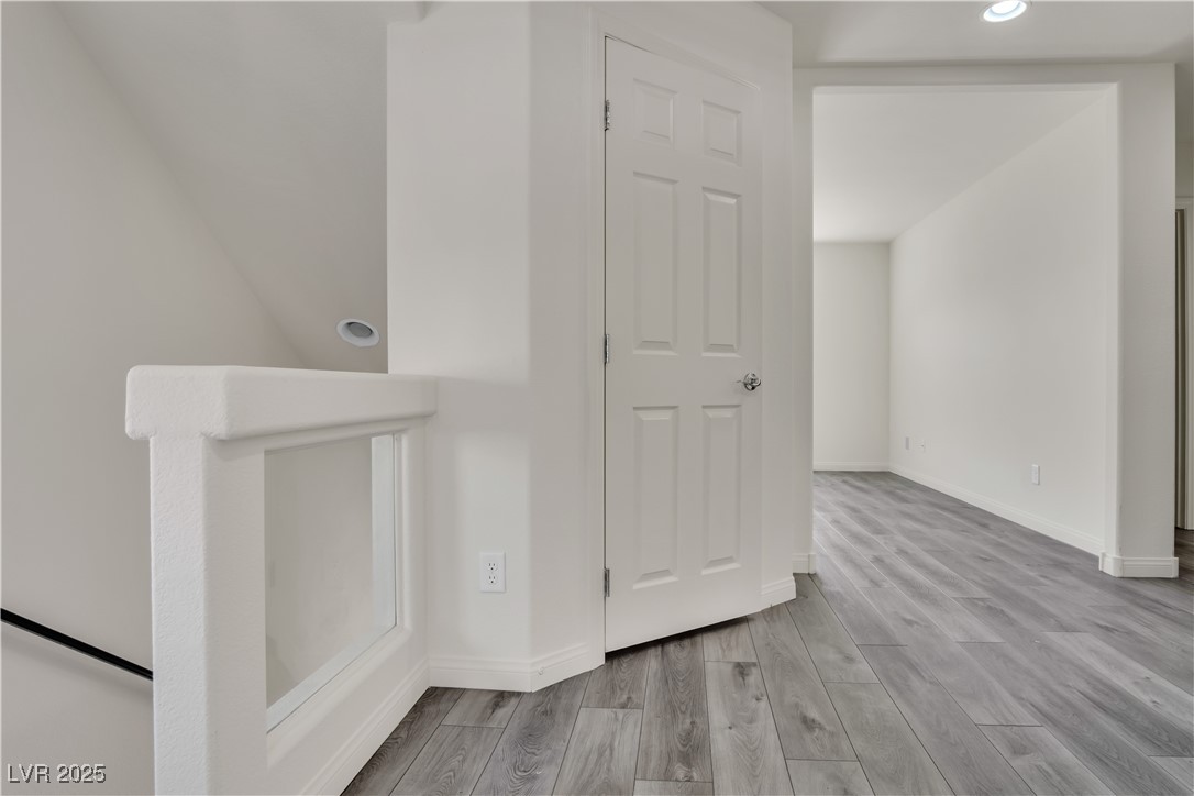 10073 Icicle Ridge Las Vegas, NV 89141 - Photo 13 of 23 Corridor featuring wood finished floors and recessed lighting