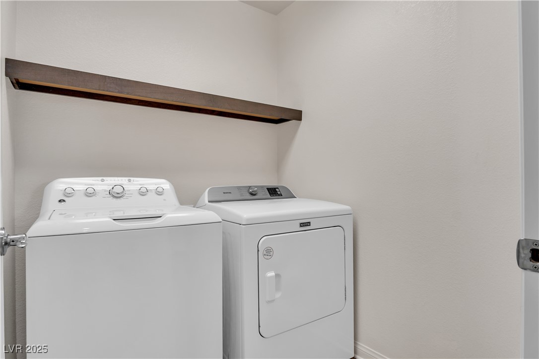 10073 Icicle Ridge Las Vegas, NV 89141 - Photo 15 of 23 Laundry room featuring independent washer and dryer