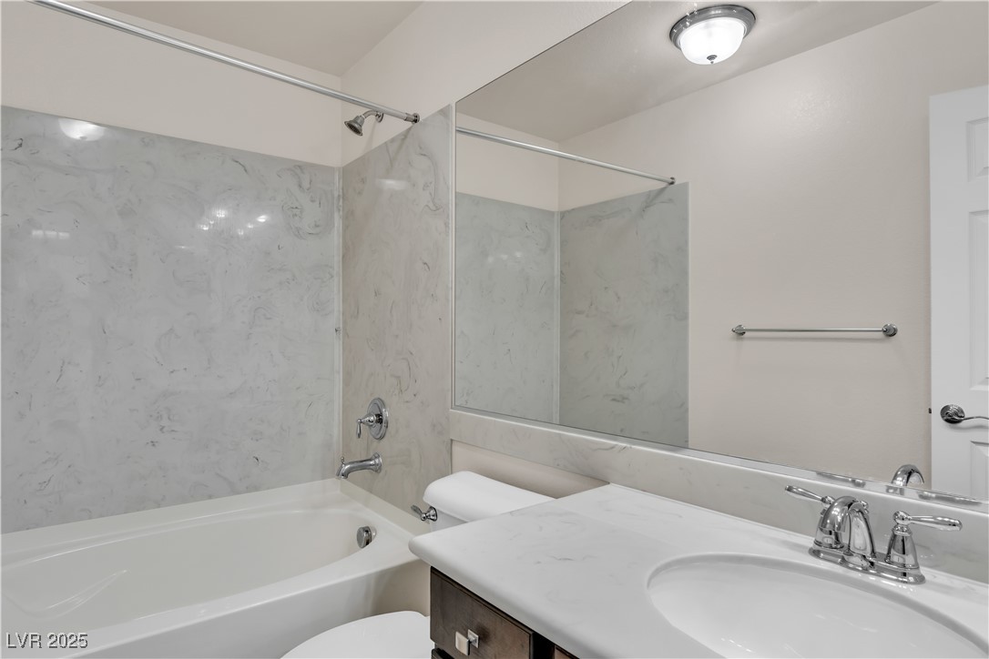 10073 Icicle Ridge Las Vegas, NV 89141 - Photo 17 of 23 Bathroom with vanity and tub / shower combination