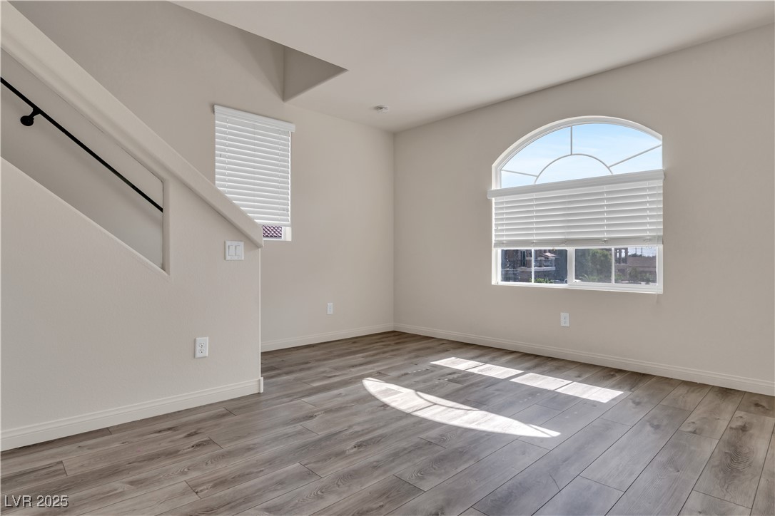 10073 Icicle Ridge Las Vegas, NV 89141 - Photo 18 of 23 Unfurnished room with wood finished floors and baseboards