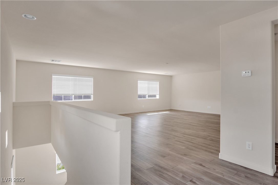 10073 Icicle Ridge Las Vegas, NV 89141 - Photo 19 of 23 Spare room featuring wood finished floors