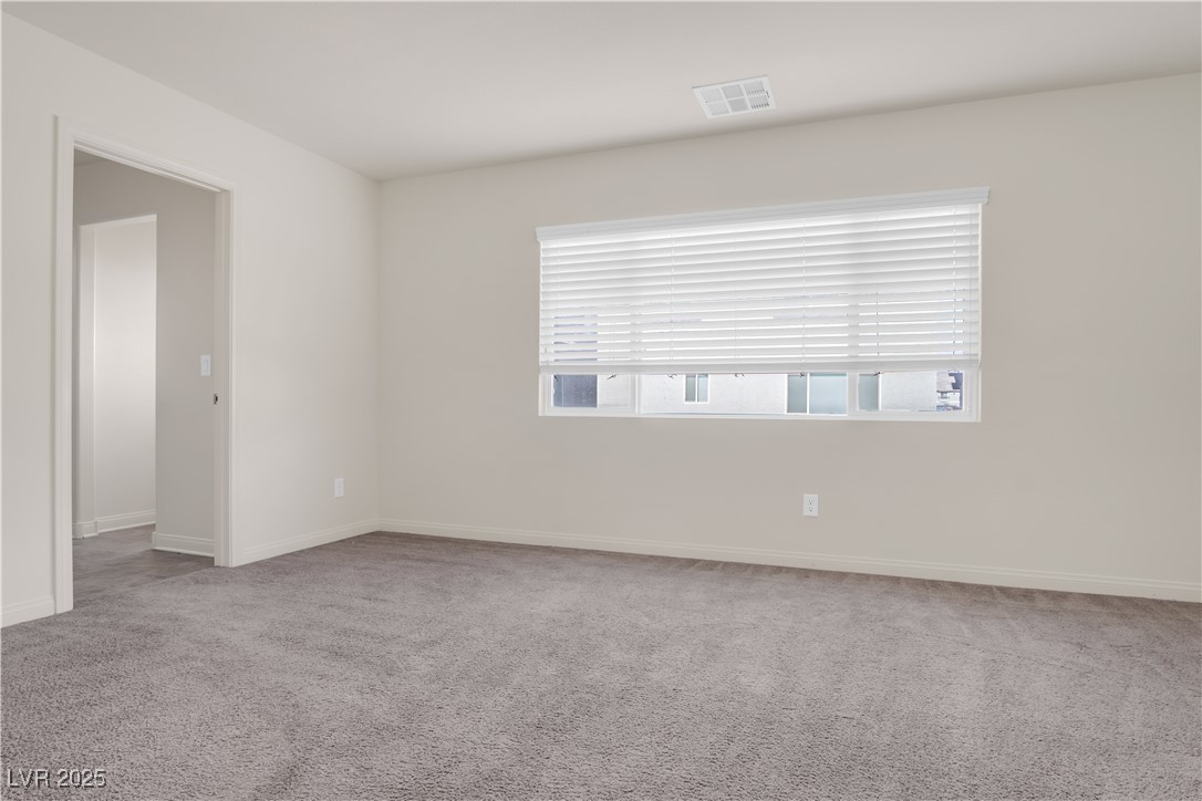 10073 Icicle Ridge Las Vegas, NV 89141 - Photo 10 of 23 Unfurnished room featuring carpet floors
