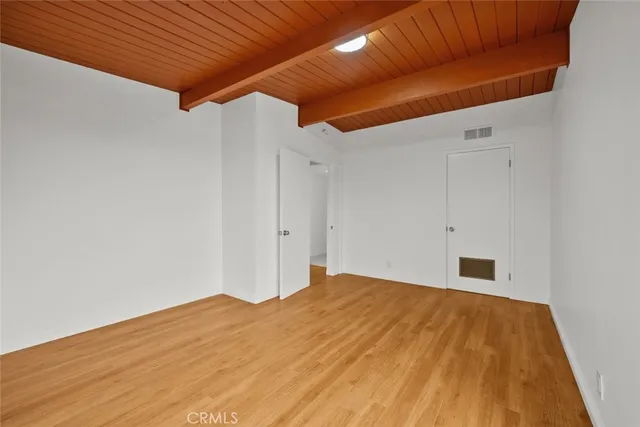 a bedroom with a bed and a ceiling fan