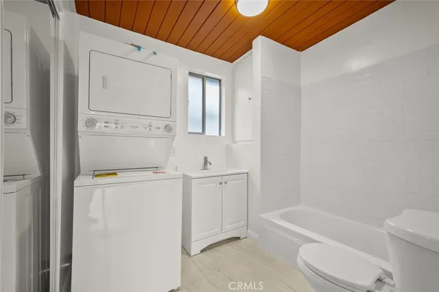 a bathroom with a sink a toilet and bathtub