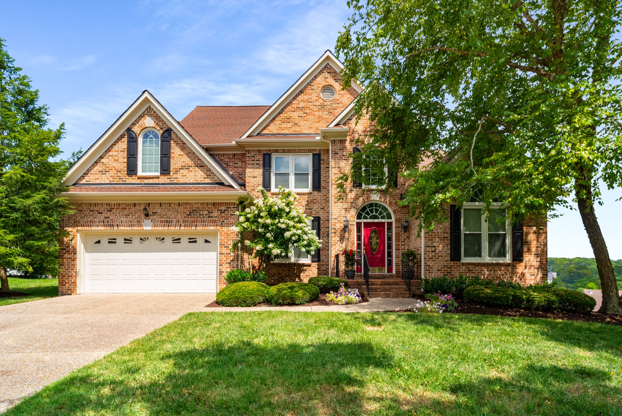 446 Savannah Way Franklin, TN 37067 - Photo 1 of 30 a front view of a house with a yard and garage