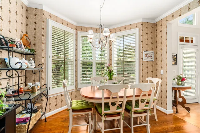 a dining room with furniture and window