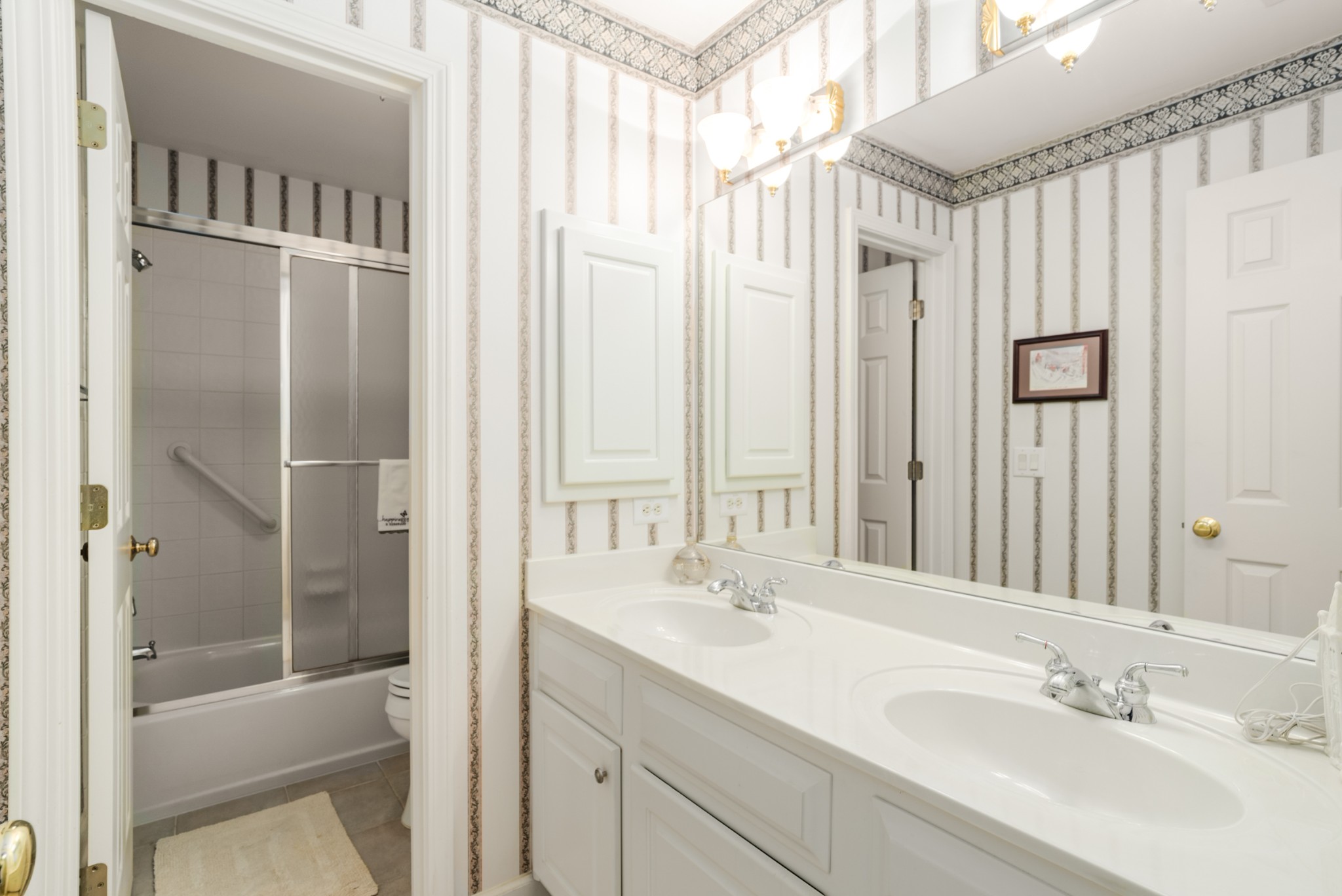 446 Savannah Way Franklin, TN 37067 - Photo 20 of 30 a bathroom with a shower sink and mirror