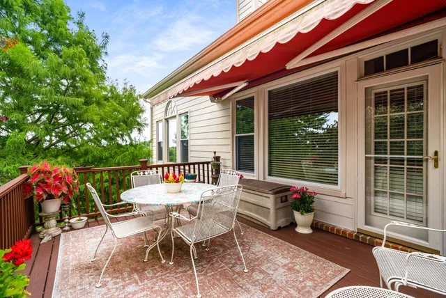 a view of a chairs and table in the patio