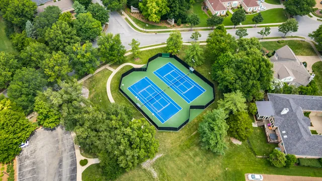 an aerial view of a house with swimming pool