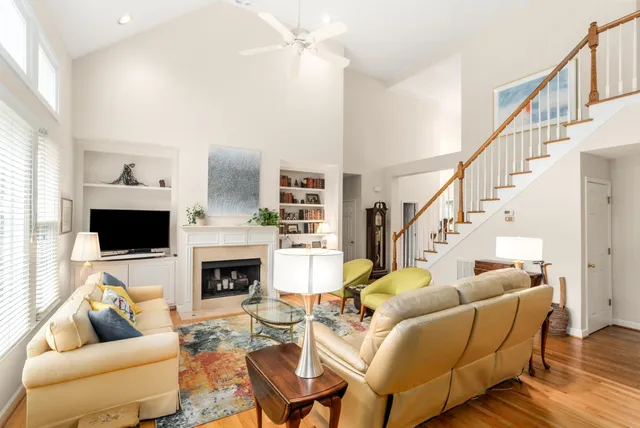 a living room with furniture fireplace and a flat screen tv