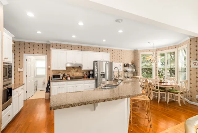 a kitchen with lots of counter top space and stainless steel appliances