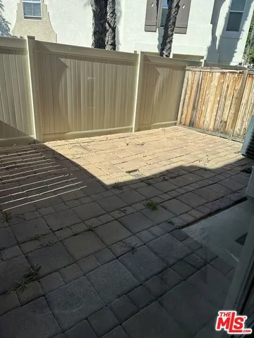 a living room with a fireplace and a rug