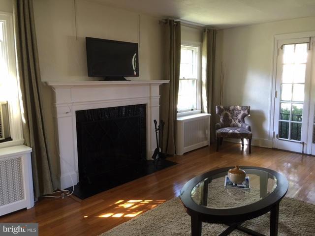4419 Underwood Road Baltimore, MD 21218 - Photo 2 of 30 a living room with furniture and a fireplace